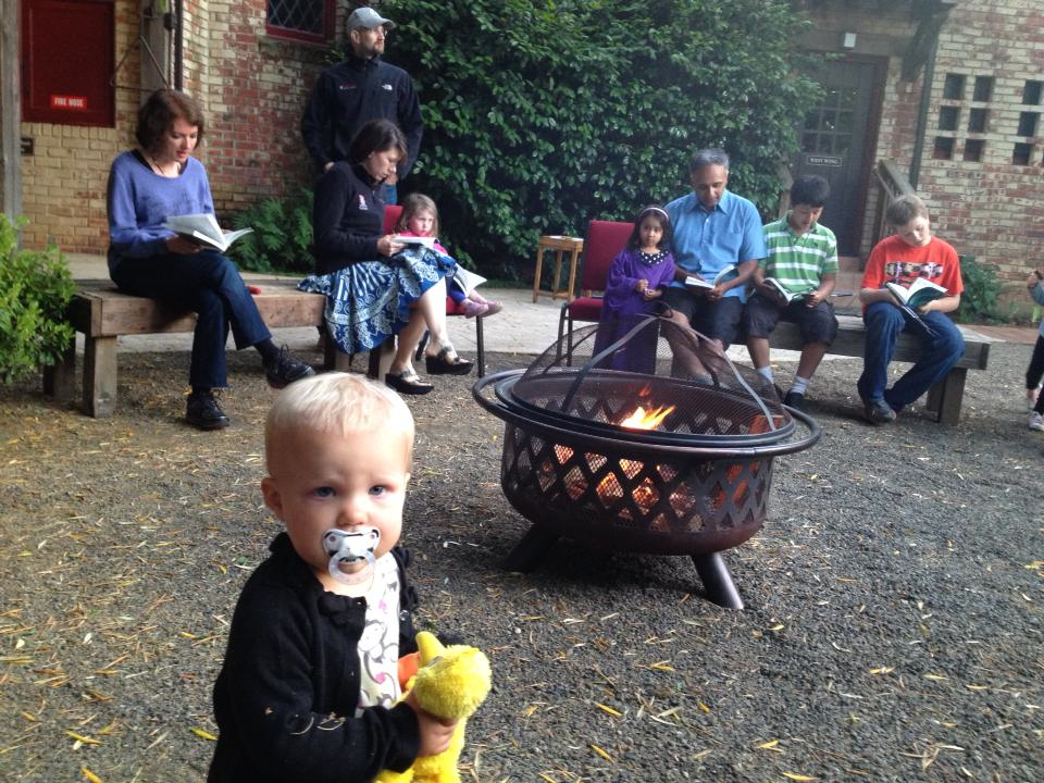 Kiersten + Mammen family at campfire at parish retreat 2013